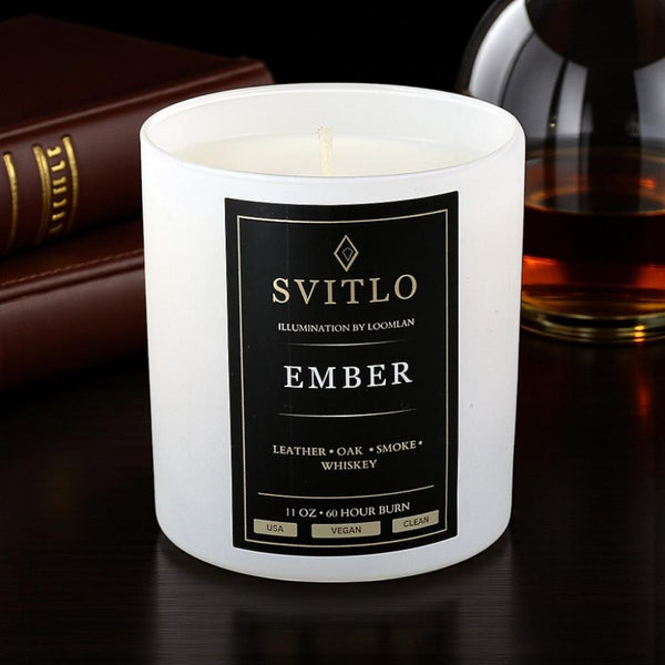 Svitlo Ember candle with a label on a dark surface