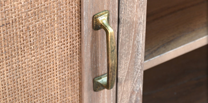 Close-up of a wooden door with a brass handle