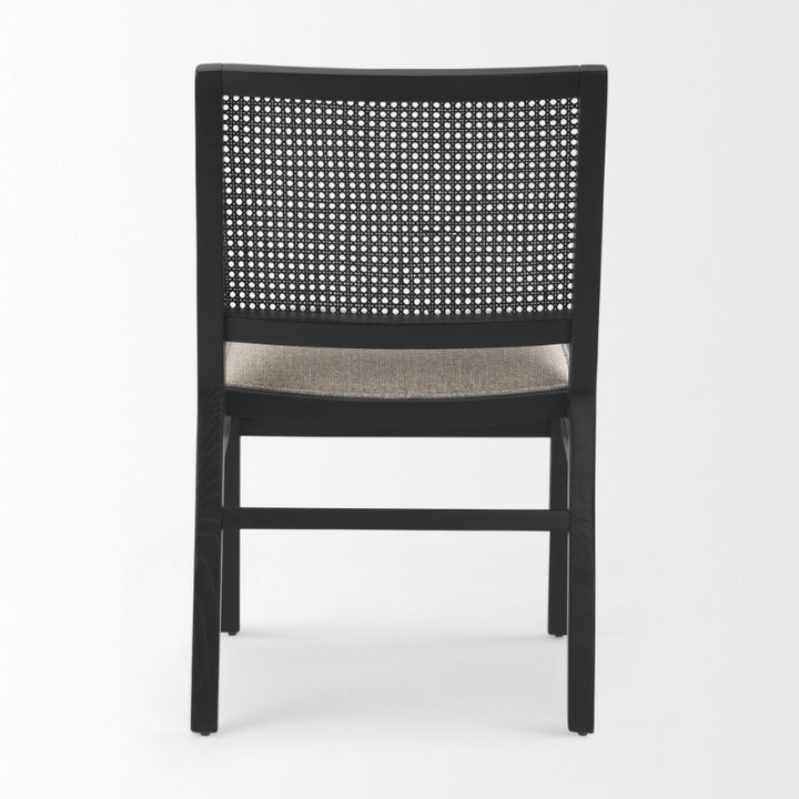 Black chair with woven backrest on a white background